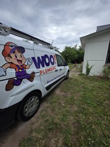 Woo Plumbing van on-site